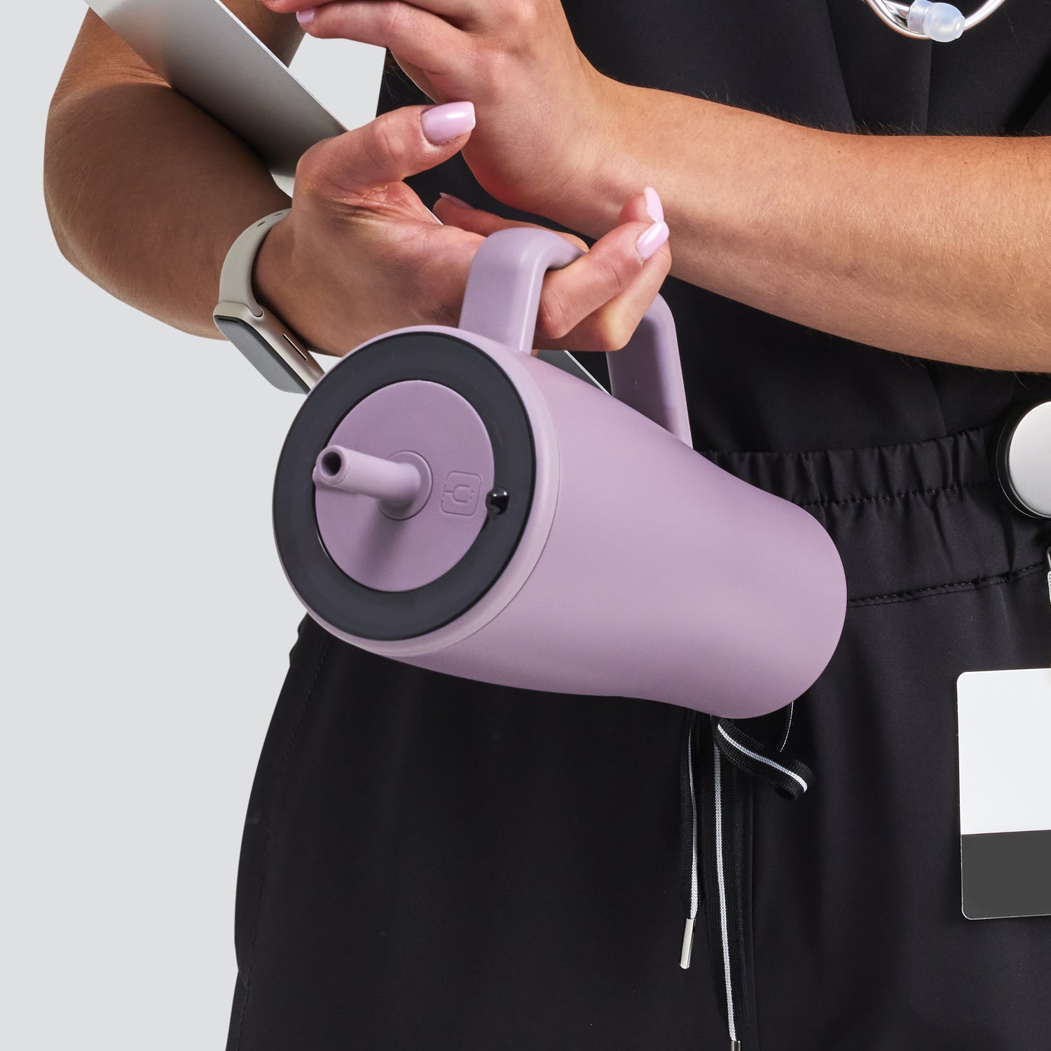 Person holding a purple Era 30oz water tumbler